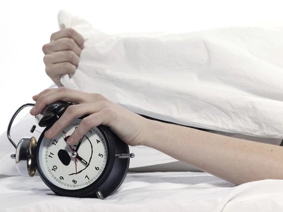 woman in bed awakening