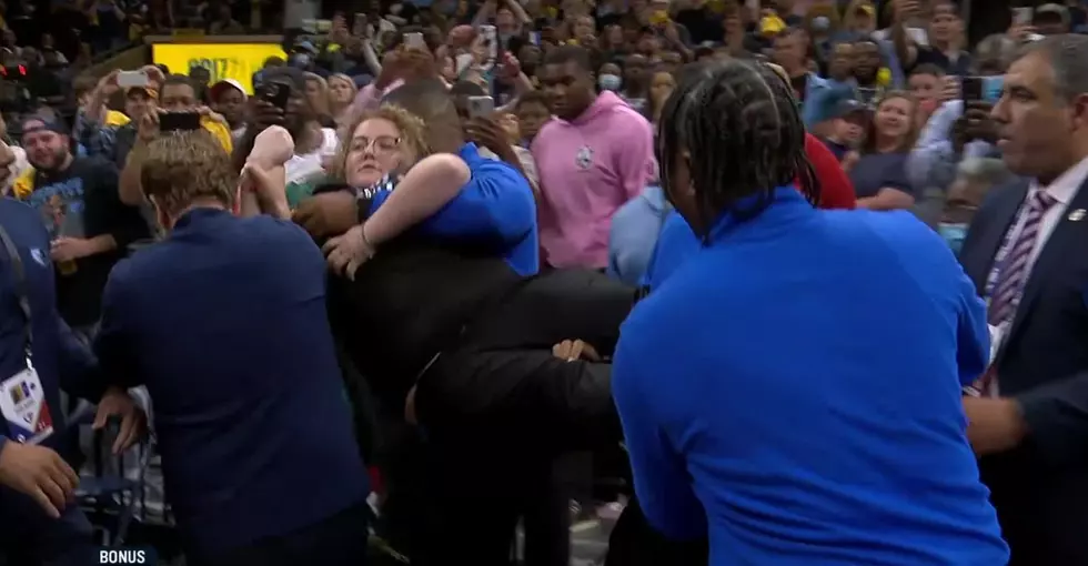 Woman Chains Herself to Basketball Goal During NBA Playoff Game